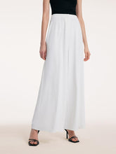 A lady wears full-length pants.